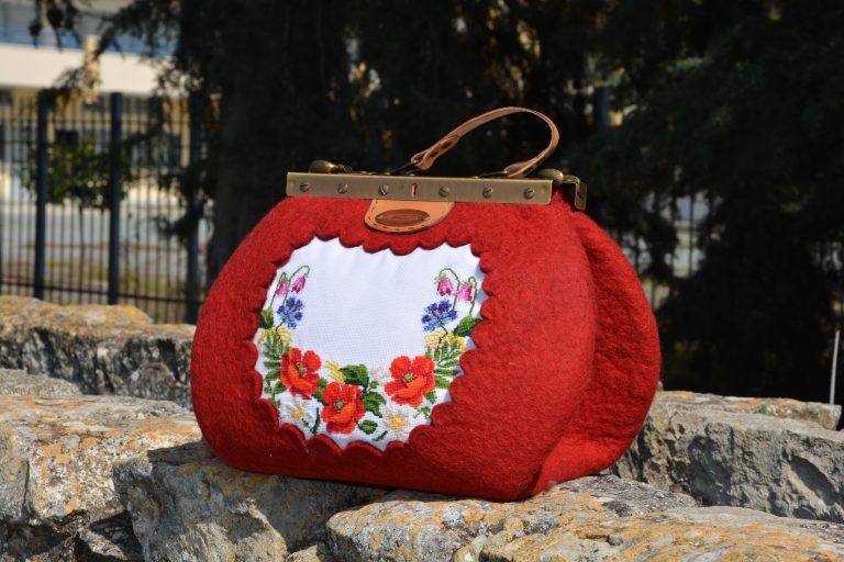 Carpetbag with metal frame.