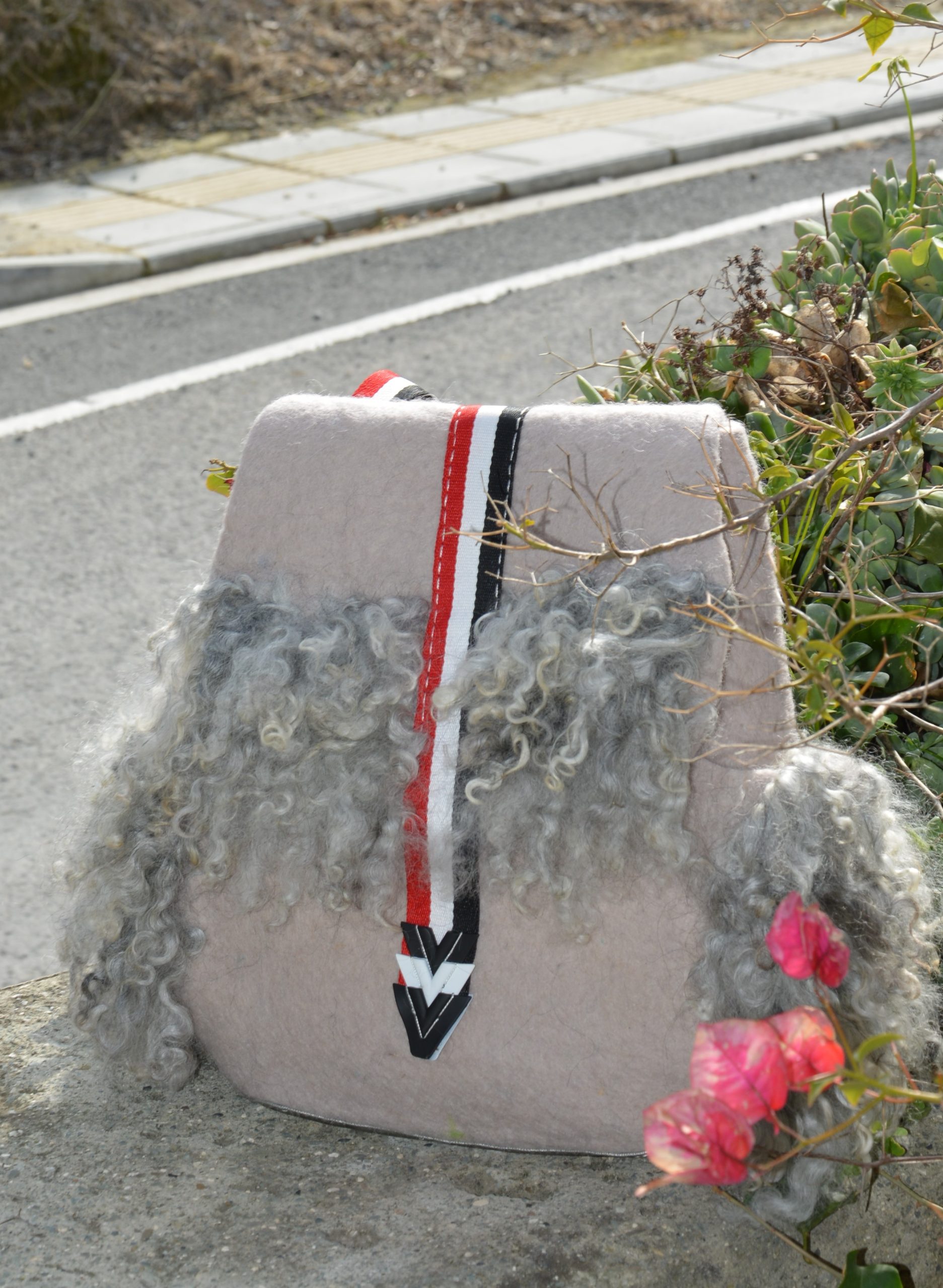 BACKPACK DECORATED WITH LOCKS.